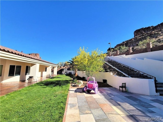 view of yard with a patio and a fenced backyard