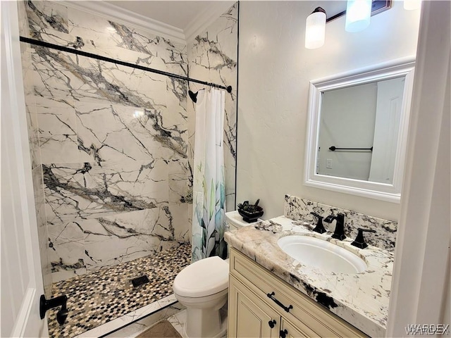 bathroom featuring vanity, a shower stall, toilet, and crown molding
