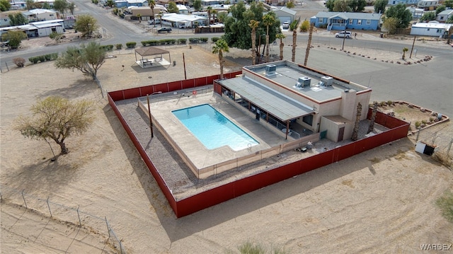 view of swimming pool with fence