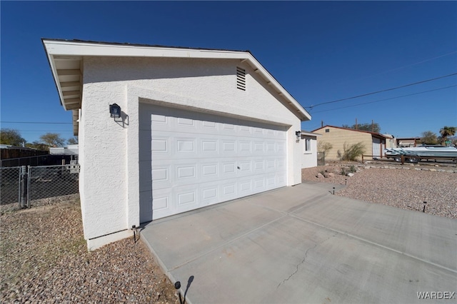 garage featuring fence