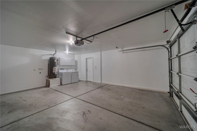 garage with washing machine and dryer, water heater, baseboards, and a garage door opener