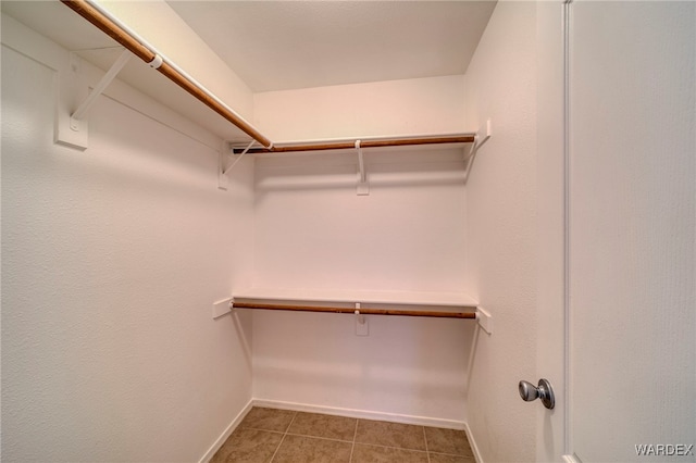 spacious closet with tile patterned flooring