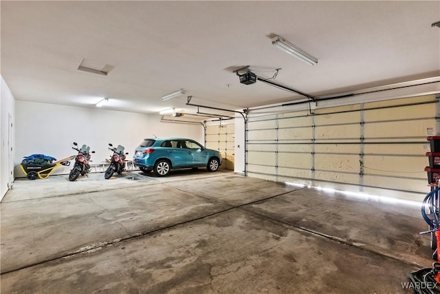 garage featuring a garage door opener