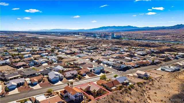 birds eye view of property with a residential view and a mountain view