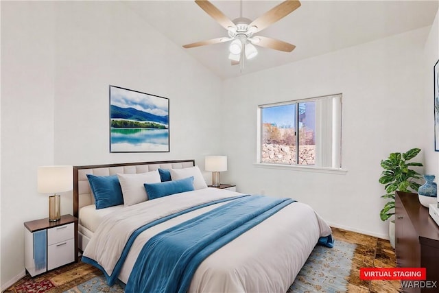 bedroom with lofted ceiling, ceiling fan, and baseboards