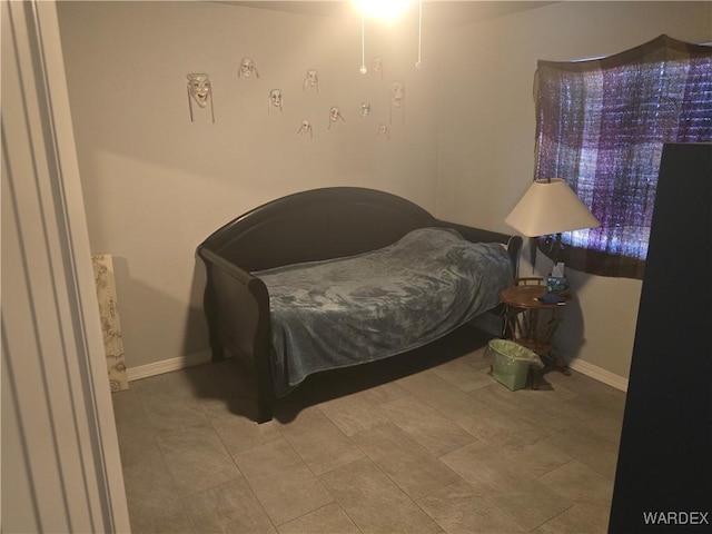 bedroom featuring baseboards