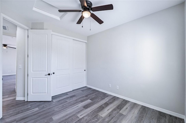 6102 S Scorpion Ln, Fort Mohave, AZ 86426 - unfurnished bedroom with wood finished floors, a closet, and ceiling fan