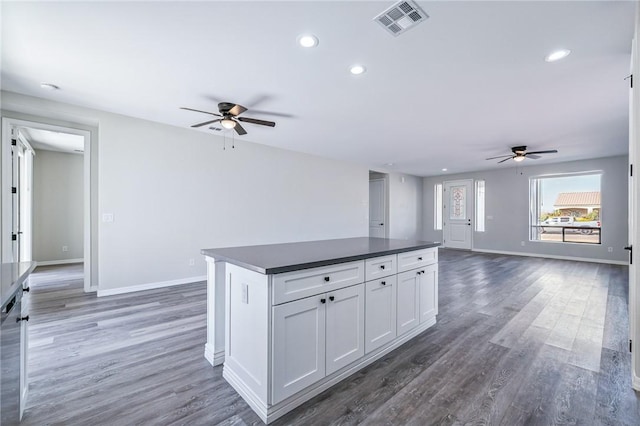 6102 S Scorpion Ln, Fort Mohave, AZ 86426 - kitchen featuring ceiling fan, dark countertops, open floor plan, dark wood finished floors, and recessed lighting