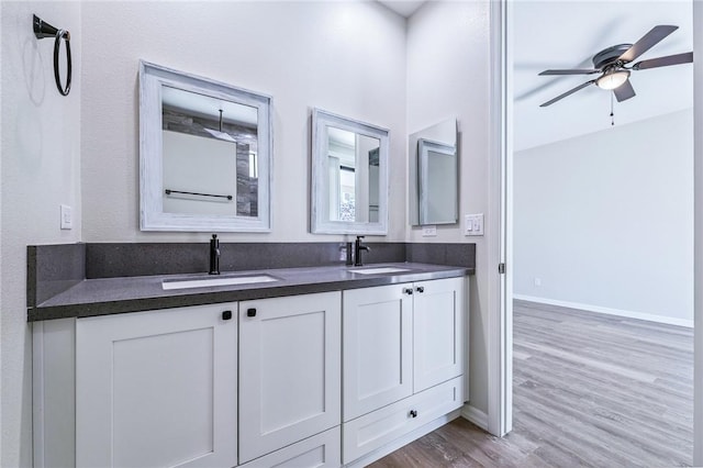 6102 S Scorpion Ln, Fort Mohave, AZ 86426 - full bathroom with double vanity, wood finished floors, and ceiling fan