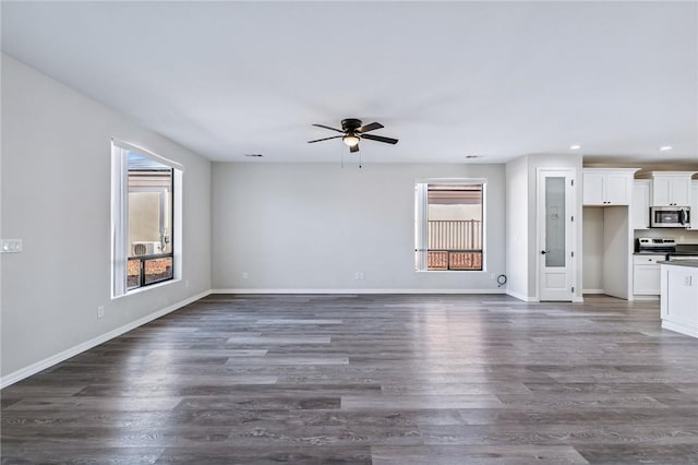 6102 S Scorpion Ln, Fort Mohave, AZ 86426 - unfurnished living room with healthy amount of natural light, ceiling fan, recessed lighting, and dark wood-style flooring