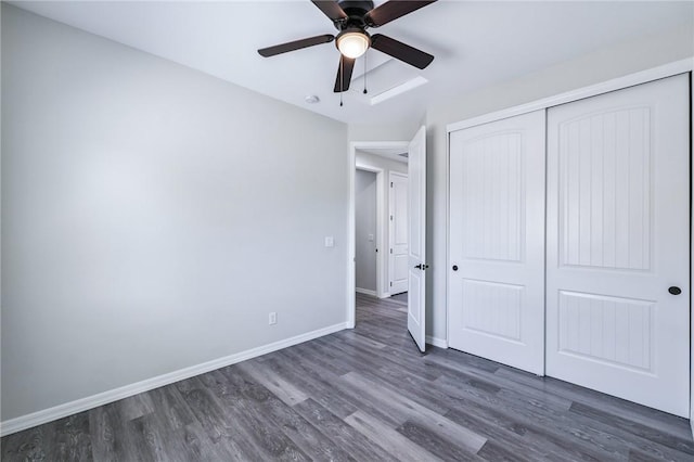 6102 S Scorpion Ln, Fort Mohave, AZ 86426 - unfurnished bedroom featuring wood finished floors, a closet, and a ceiling fan