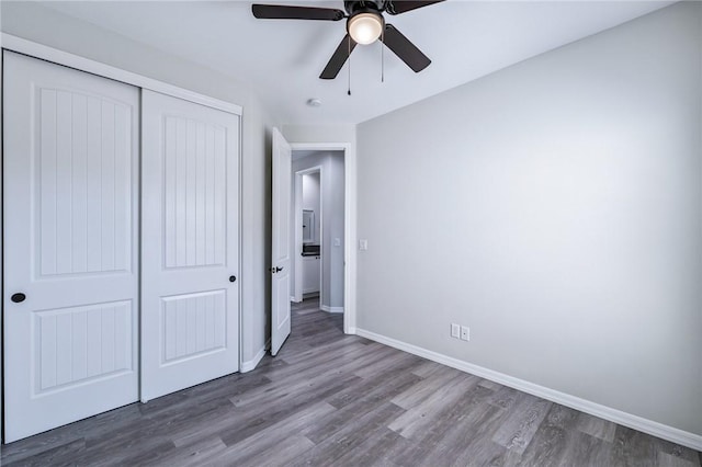 6102 S Scorpion Ln, Fort Mohave, AZ 86426 - unfurnished bedroom with wood finished floors, a closet, and a ceiling fan