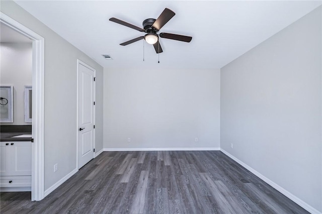 6102 S Scorpion Ln, Fort Mohave, AZ 86426 - unfurnished bedroom featuring dark wood-style flooring and ceiling fan