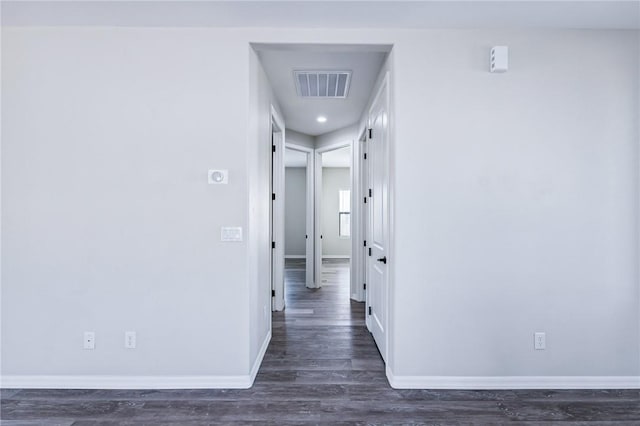 6102 S Scorpion Ln, Fort Mohave, AZ 86426 - hallway with dark wood-style floors and baseboards