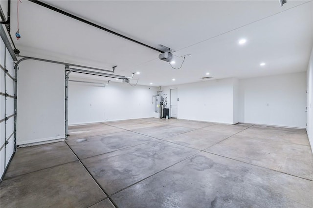 6102 S Scorpion Ln, Fort Mohave, AZ 86426 - garage with a garage door opener, recessed lighting, and water heater