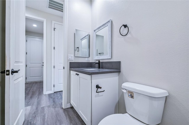 6102 S Scorpion Ln, Fort Mohave, AZ 86426 - half bath featuring vanity and wood finished floors