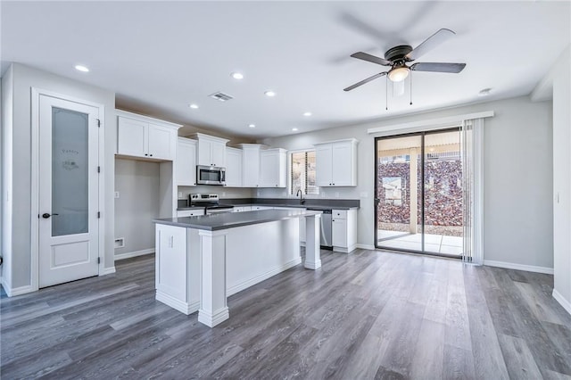 6102 S Scorpion Ln, Fort Mohave, AZ 86426 - kitchen featuring appliances with stainless steel finishes, white cabinetry, dark wood-style flooring, a ceiling fan, and recessed lighting
