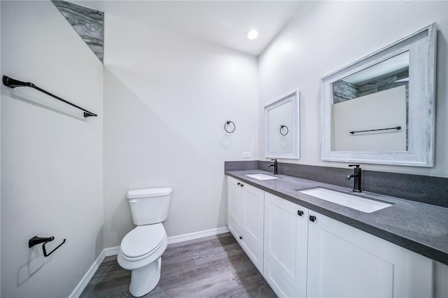 6102 S Scorpion Ln, Fort Mohave, AZ 86426 - bathroom featuring double vanity, wood finished floors, and recessed lighting