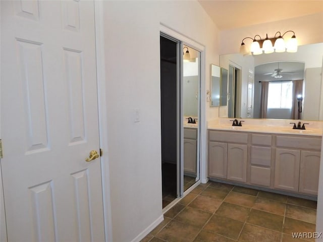 bathroom with double vanity and a sink