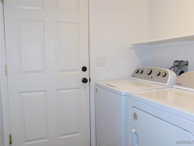 washroom with laundry area and washing machine and clothes dryer