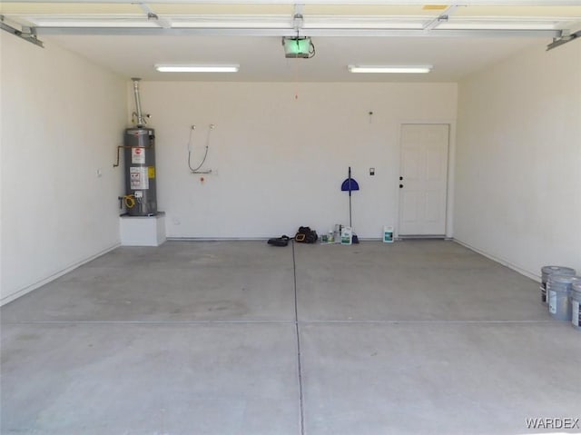 garage with water heater and a garage door opener