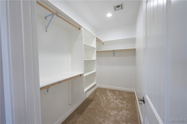 spacious closet featuring light carpet and visible vents