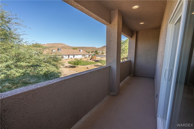 balcony featuring a mountain view