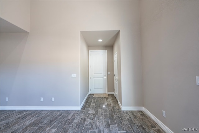 interior space with dark wood-style floors and baseboards