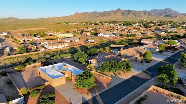 drone / aerial view featuring a residential view and a mountain view