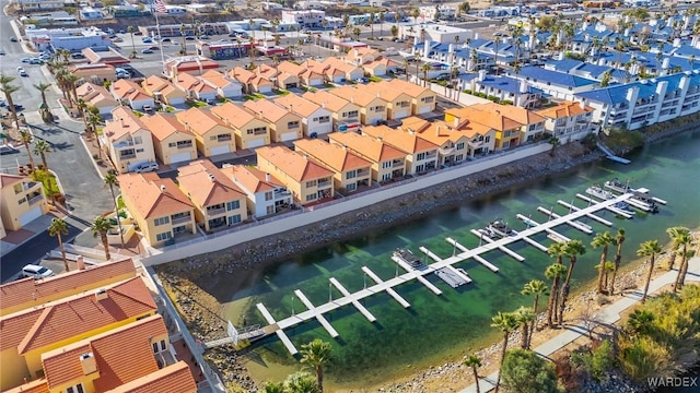 birds eye view of property with a residential view and a water view