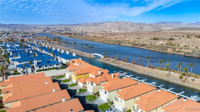 birds eye view of property with a residential view and a water and mountain view