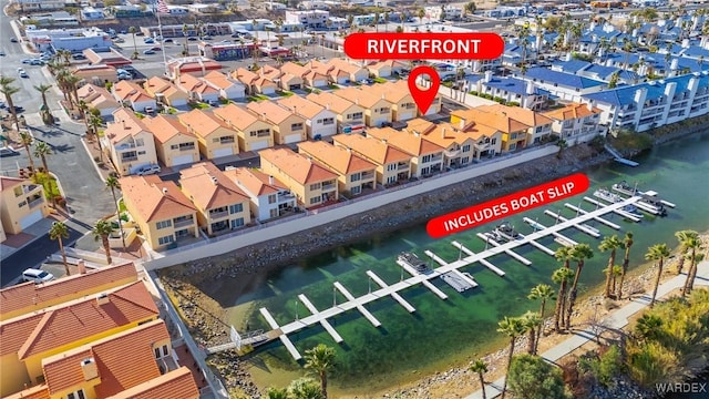 aerial view with a water view and a residential view