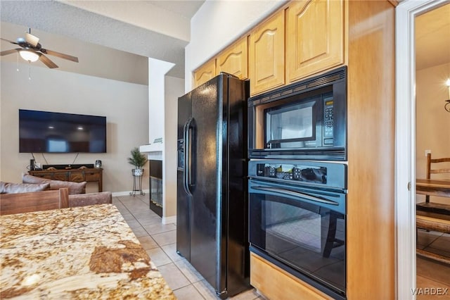 kitchen featuring open floor plan, light tile patterned flooring, ceiling fan, light brown cabinets, and black appliances