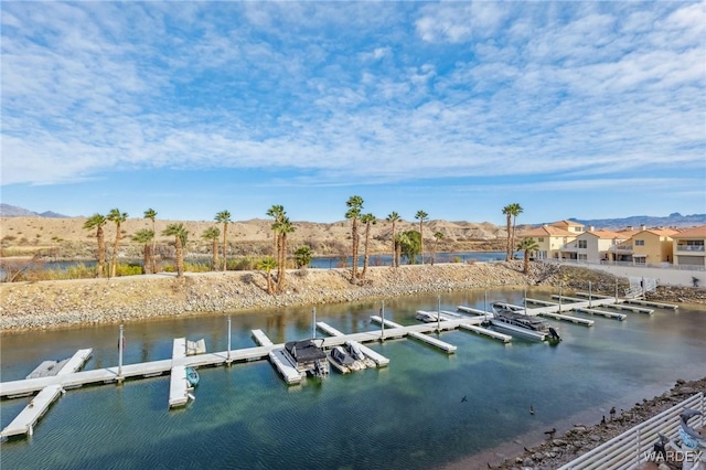 view of dock featuring a residential view and a water and mountain view