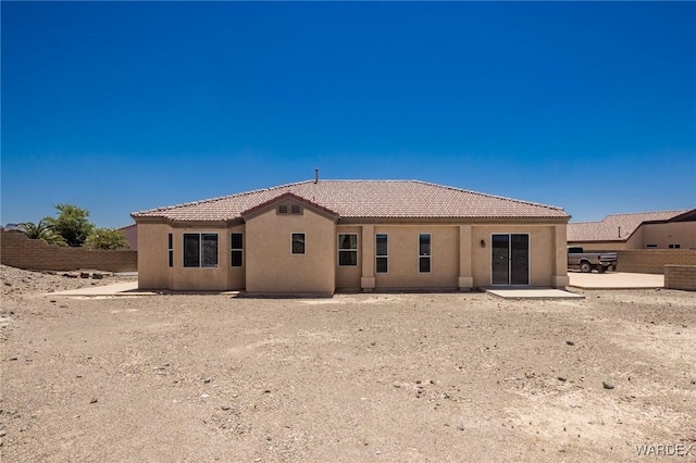 back of house with a patio, fence, a tile roof, and stucco siding