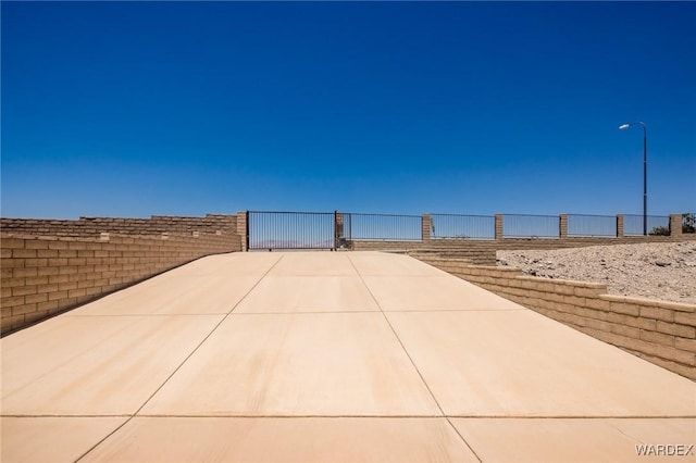 view of property's community featuring fence