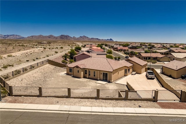 birds eye view of property with a residential view and a mountain view