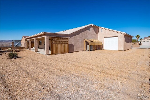 view of front of property with driveway and stucco siding