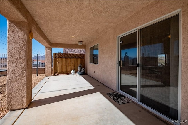 view of patio featuring fence