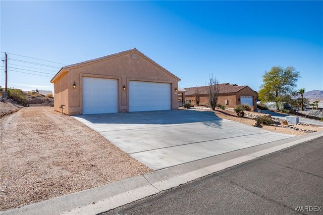 view of front of house featuring a garage and stucco siding