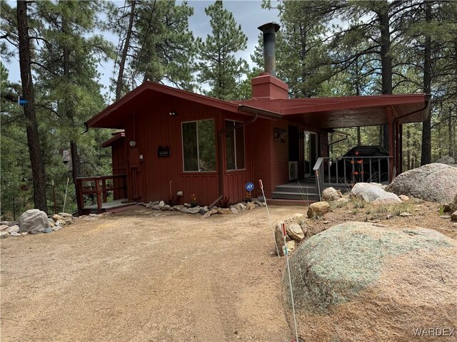 exterior space featuring a chimney