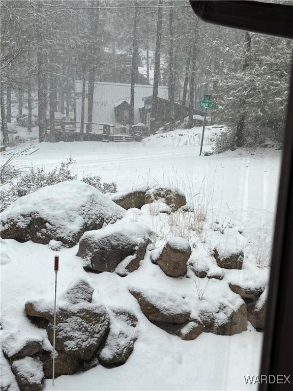 snowy yard with fence