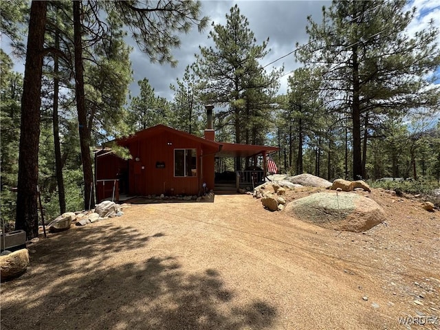 view of side of home with a chimney