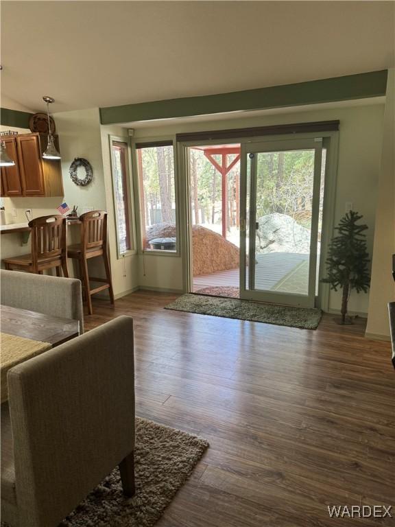 living room featuring dark wood-style floors and baseboards