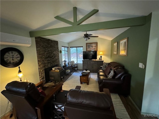 living area with lofted ceiling with beams, ceiling fan, wood finished floors, a wall mounted air conditioner, and a fireplace