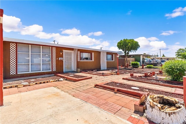 back of property with a patio area