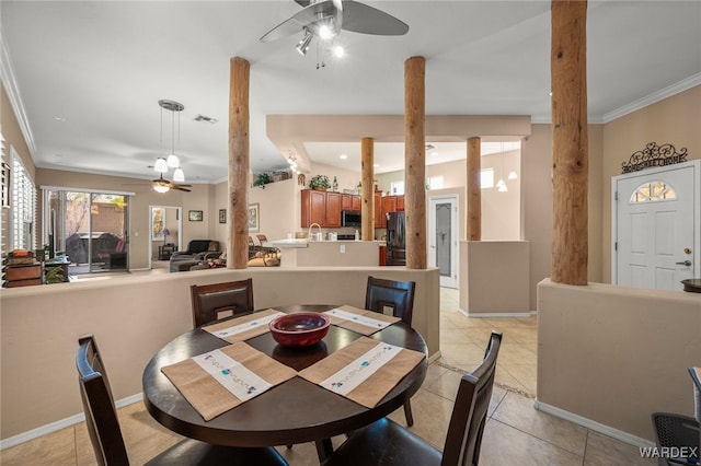 dining area featuring ceiling fan, baseboards, visible vents, and crown molding