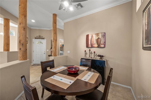 dining space featuring ornamental molding, visible vents, decorative columns, and baseboards