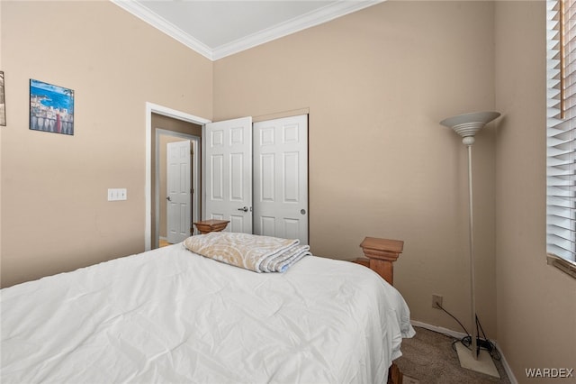 bedroom featuring baseboards, carpet flooring, and crown molding