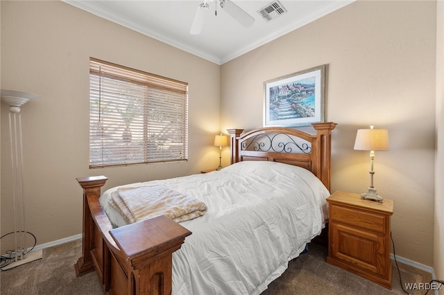 bedroom featuring baseboards, visible vents, ceiling fan, crown molding, and dark carpet